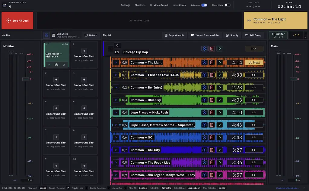 DonWells Cue main workspace with a color-coded playlist, One Shots grid, and output meters